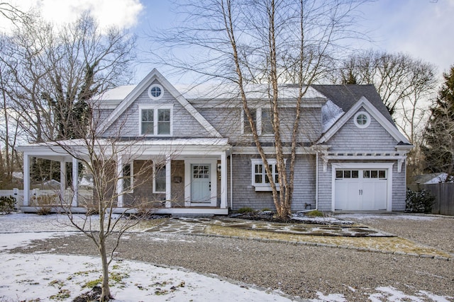 view of front of home featuring a porch and a garage