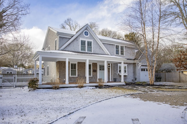 view of front facade featuring a garage and covered porch