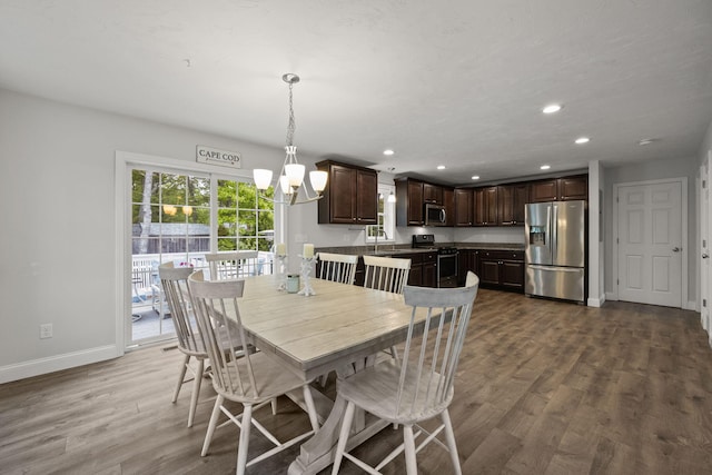 57 Melgo Ln, South Yarmouth, MA 02664 - dining space with baseboards, dark wood-style flooring, recessed lighting, and a chandelier
