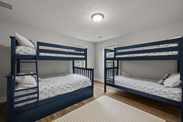 57 Melgo Ln, South Yarmouth, MA 02664 - bedroom featuring wood finished floors and baseboards