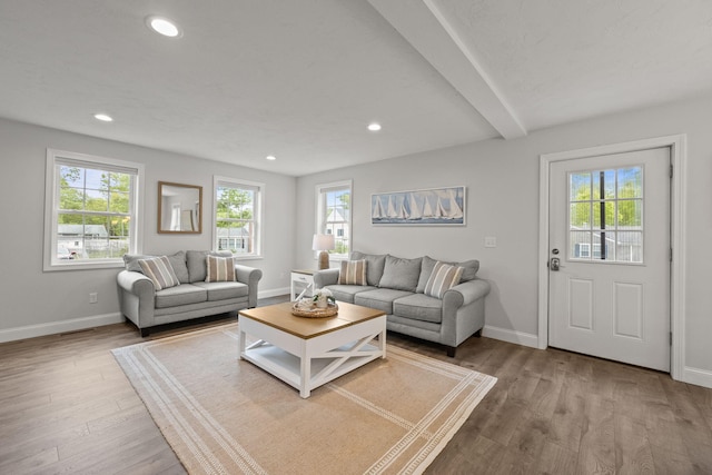 57 Melgo Ln, South Yarmouth, MA 02664 - living room featuring plenty of natural light, wood finished floors, baseboards, recessed lighting, and beam ceiling