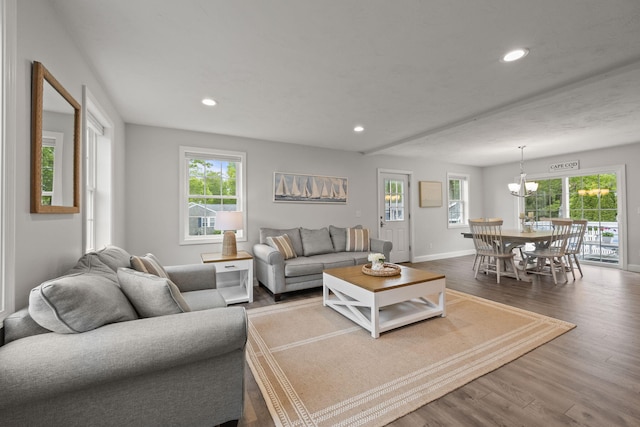 57 Melgo Ln, South Yarmouth, MA 02664 - living area with plenty of natural light, wood finished floors, recessed lighting, baseboards, and a chandelier