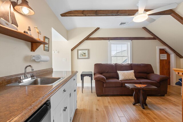 living room featuring light wood-style floors and a ceiling fan