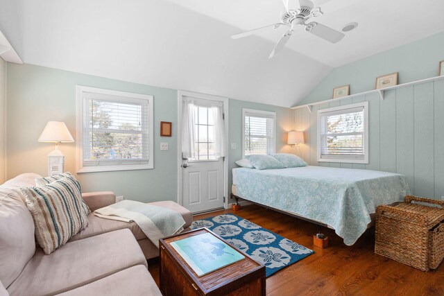 bedroom featuring wood finished floors, lofted ceiling, and ceiling fan