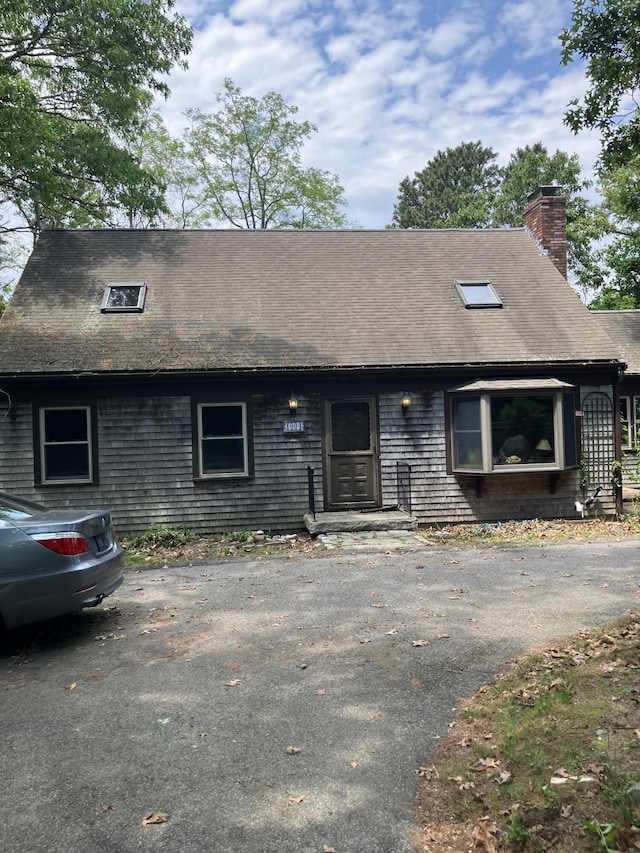 1094 County Rd, Pocasset, MA 02559 - view of front facade featuring a chimney and a shingled roof