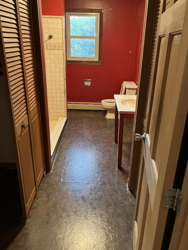 1094 County Rd, Pocasset, MA 02559 - bathroom featuring a baseboard radiator, tiled shower, vanity, and a closet