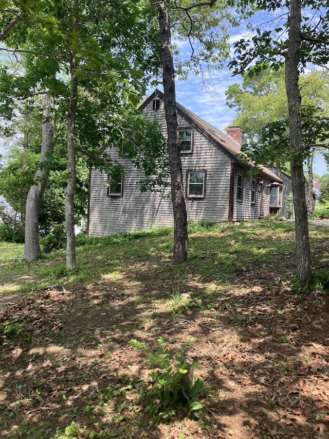1094 County Rd, Pocasset, MA 02559 - view of side of property featuring a chimney