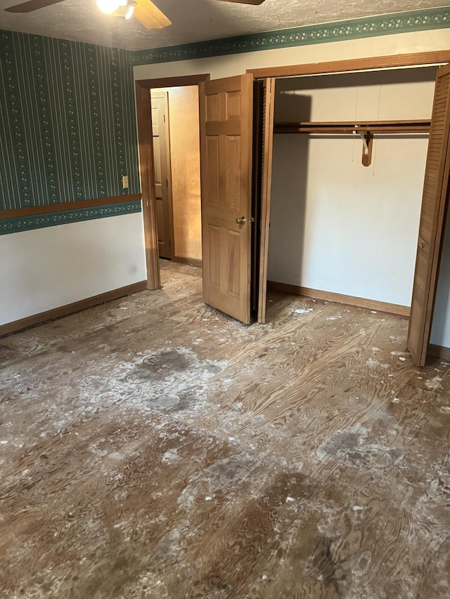 1094 County Rd, Pocasset, MA 02559 - unfurnished bedroom featuring a closet and baseboards