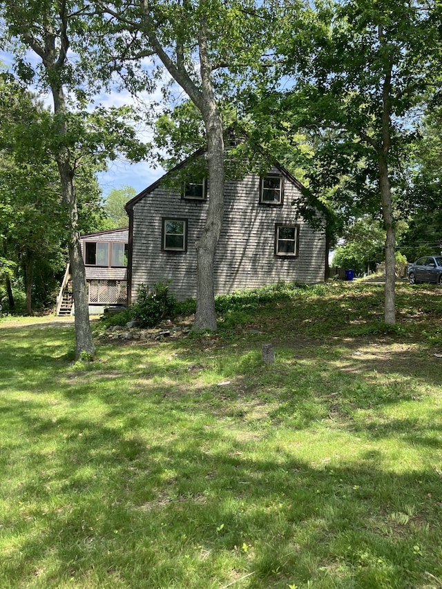 1094 County Rd, Pocasset, MA 02559 - view of side of home with a lawn
