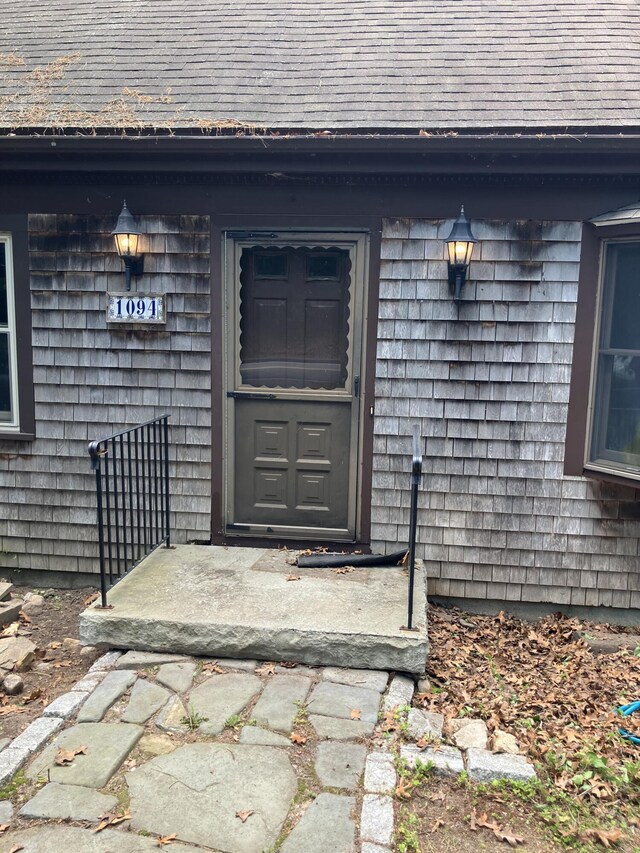 1094 County Rd, Pocasset, MA 02559 - property entrance featuring roof with shingles