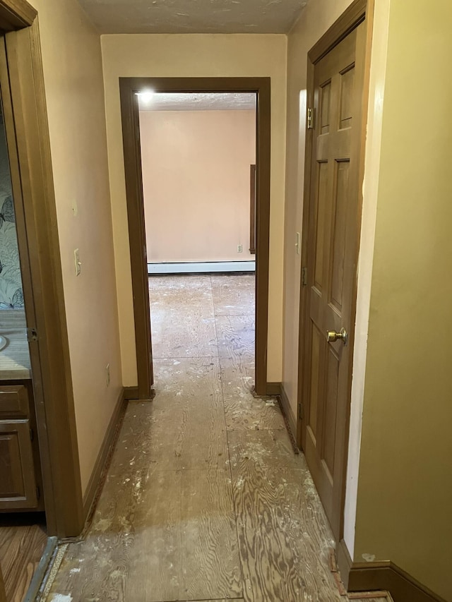1094 County Rd, Pocasset, MA 02559 - corridor featuring a baseboard radiator and baseboards