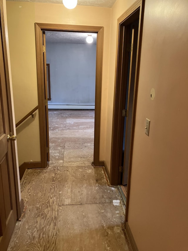 1094 County Rd, Pocasset, MA 02559 - corridor with a baseboard heating unit