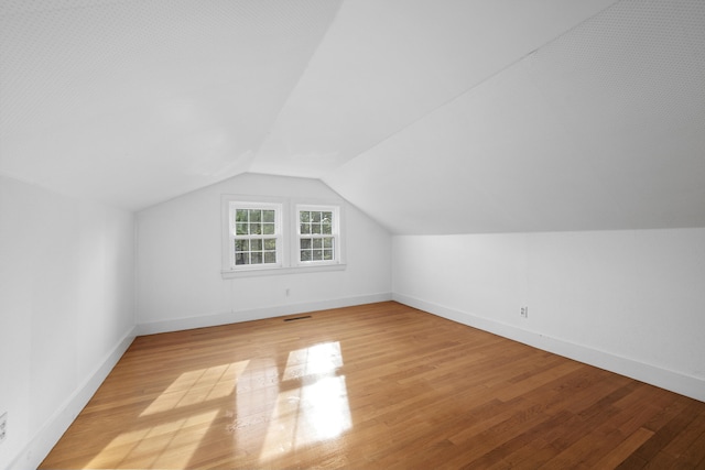 175 Lower County Rd, West Harwich, MA 02671 - bonus room with light wood-style floors, vaulted ceiling, and baseboards