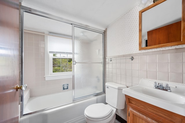 175 Lower County Rd, West Harwich, MA 02671 - bathroom featuring toilet, vanity, enclosed tub / shower combo, wallpapered walls, and tile walls