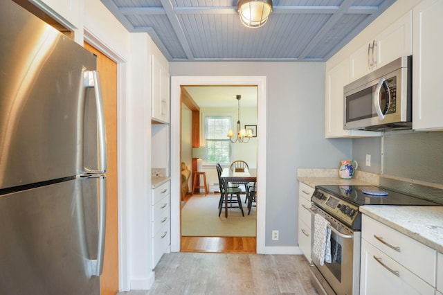 110 Teaticket Path, East Falmouth, MA 02536 - kitchen featuring appliances with stainless steel finishes, light wood-style flooring, white cabinetry, a chandelier, and wood ceiling
