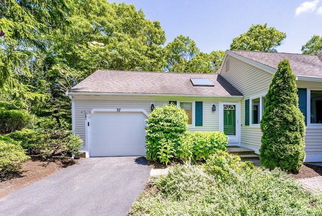 37 Pine Hill Blvd, Mashpee, MA 02649 - view of front of property featuring driveway, an attached garage, and a shingled roof