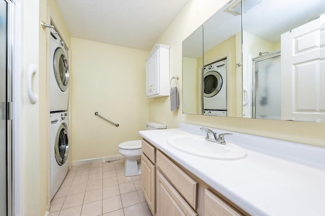 37 Pine Hill Blvd, Mashpee, MA 02649 - bathroom featuring stacked washing machine and dryer, a shower with shower door, tile patterned flooring, and vanity