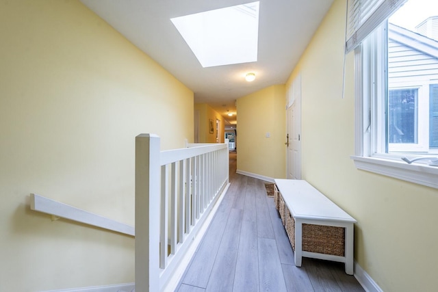 37 Pine Hill Blvd, Mashpee, MA 02649 - hall featuring a skylight, wood finished floors, and an upstairs landing