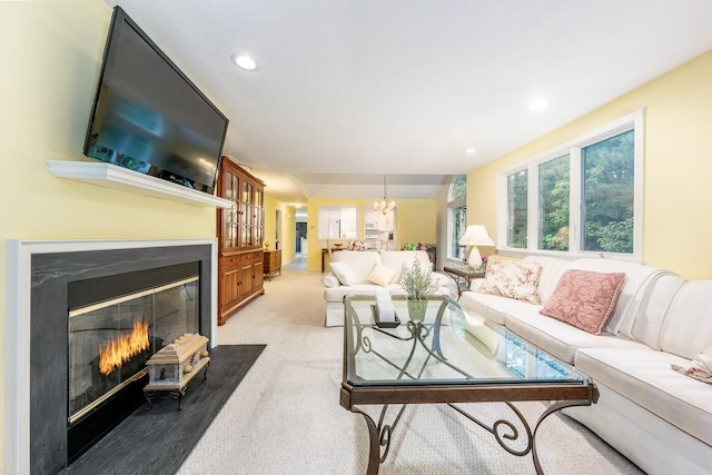 37 Pine Hill Blvd, Mashpee, MA 02649 - living room featuring a fireplace with flush hearth, a chandelier, recessed lighting, and light carpet