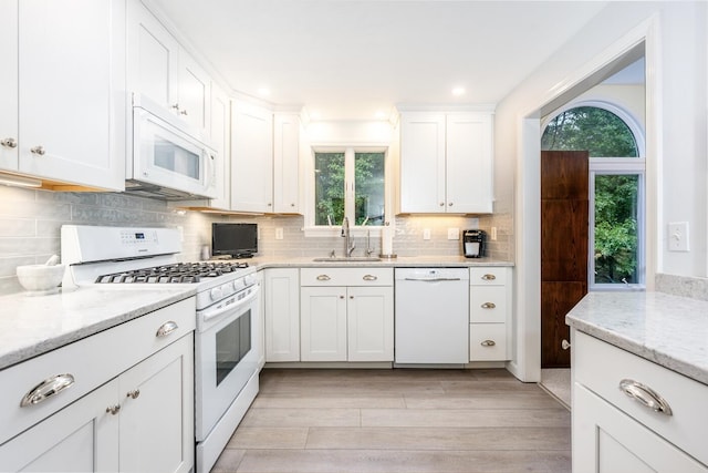 37 Pine Hill Blvd, Mashpee, MA 02649 - kitchen with white appliances, plenty of natural light, white cabinetry, backsplash, and recessed lighting