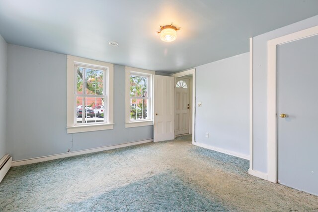 22 Browne St, Provincetown, MA 02657 - empty room with carpet flooring, baseboards, and a baseboard radiator