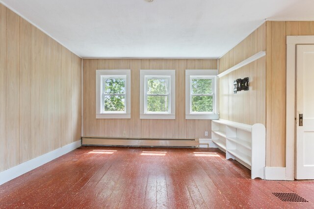 22 Browne St, Provincetown, MA 02657 - interior space featuring a baseboard heating unit, hardwood / wood-style flooring, and wood walls