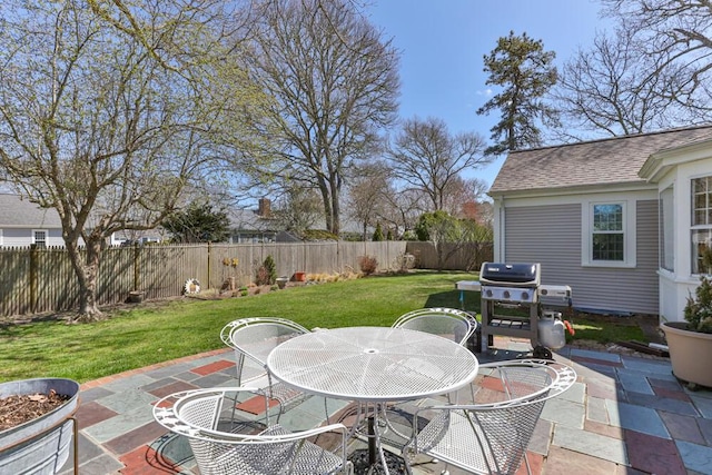56 Fairwood Rd, South Yarmouth, MA 02664 - view of patio with a fenced backyard, outdoor dining area, and a grill