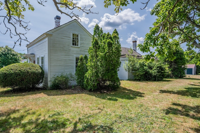 view of side of property featuring a yard