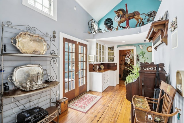 100 Eliot St, Natick, MA 01760 - interior space with high vaulted ceiling, light hardwood / wood-style floors, and french doors