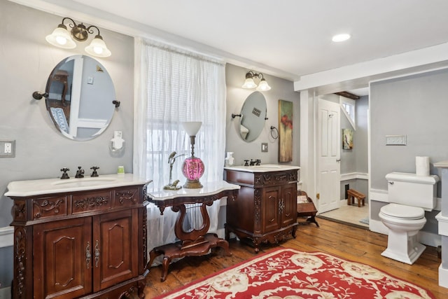 100 Eliot St, Natick, MA 01760 - bathroom with vanity, hardwood / wood-style floors, and toilet