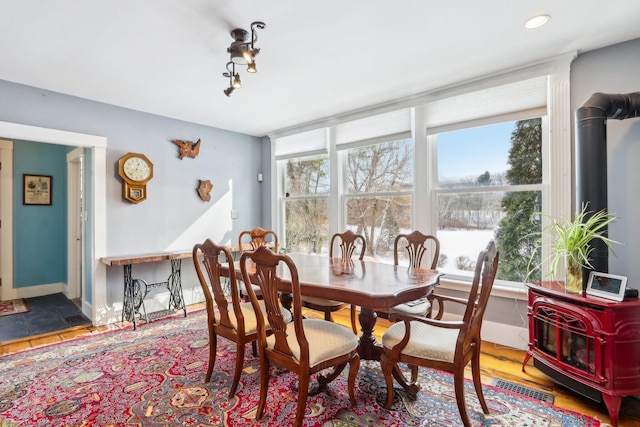 100 Eliot St, Natick, MA 01760 - tiled dining space featuring a wood stove