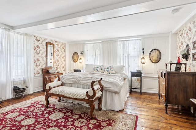 100 Eliot St, Natick, MA 01760 - bedroom with wood-type flooring and beam ceiling