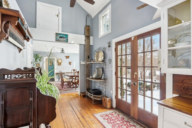 100 Eliot St, Natick, MA 01760 - entryway with french doors, ceiling fan, high vaulted ceiling, and light hardwood / wood-style flooring