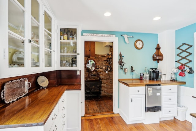 100 Eliot St, Natick, MA 01760 - bar with white cabinetry, wooden counters, and light wood-type flooring