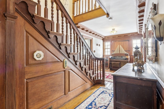 100 Eliot St, Natick, MA 01760 - entryway featuring crown molding and light hardwood / wood-style floors