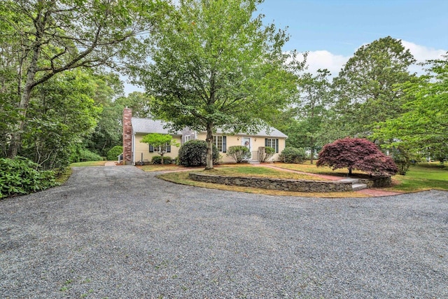 31 John Joseph Rd, Harwich, MA 02645 - view of front of house featuring gravel driveway and a chimney