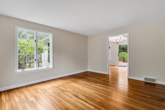 31 John Joseph Rd, Harwich, MA 02645 - empty room featuring a chandelier and wood finished floors