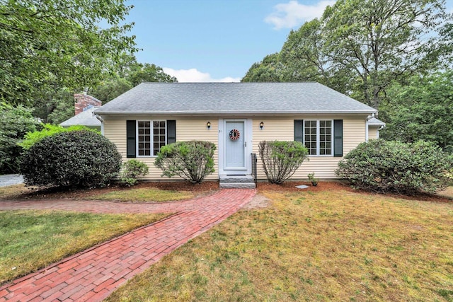 31 John Joseph Rd, Harwich, MA 02645 - view of front of property with a front yard and roof with shingles