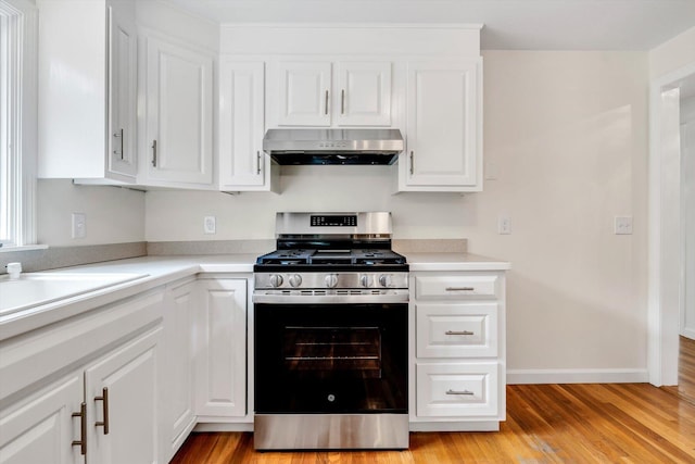31 John Joseph Rd, Harwich, MA 02645 - kitchen featuring stainless steel gas range oven, under cabinet range hood, and white cabinets