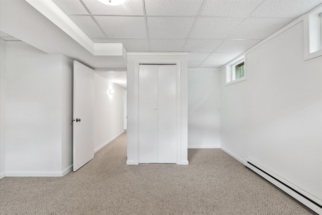 31 John Joseph Rd, Harwich, MA 02645 - basement featuring a baseboard heating unit, carpet, and a paneled ceiling