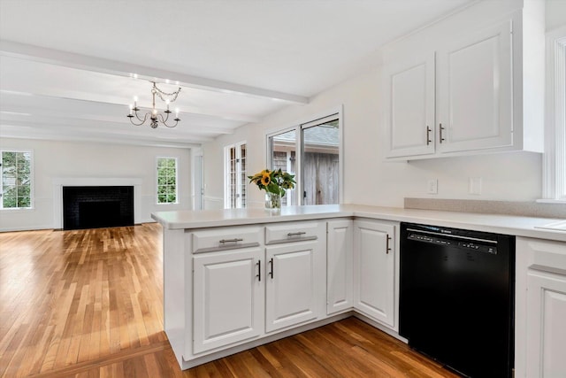 31 John Joseph Rd, Harwich, MA 02645 - kitchen featuring dishwasher, beam ceiling, light wood-style floors, a peninsula, and white cabinetry