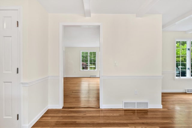 31 John Joseph Rd, Harwich, MA 02645 - spare room featuring beam ceiling, wood finished floors, and healthy amount of natural light
