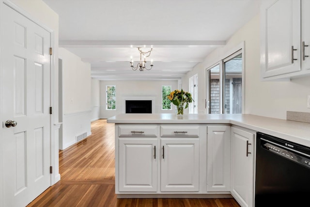 31 John Joseph Rd, Harwich, MA 02645 - kitchen featuring dishwasher, beamed ceiling, a chandelier, white cabinetry, and a peninsula