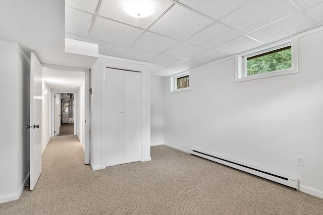 31 John Joseph Rd, Harwich, MA 02645 - unfurnished bedroom with a baseboard heating unit, carpet flooring, a paneled ceiling, and a closet