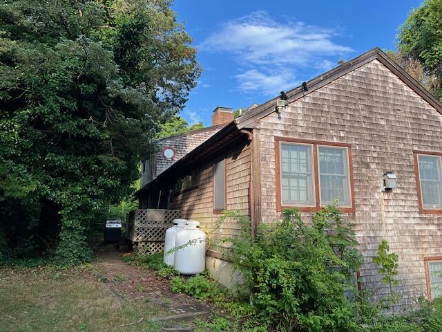 10 Hemenway Ct, Eastham, MA 02642 - view of property exterior featuring a chimney