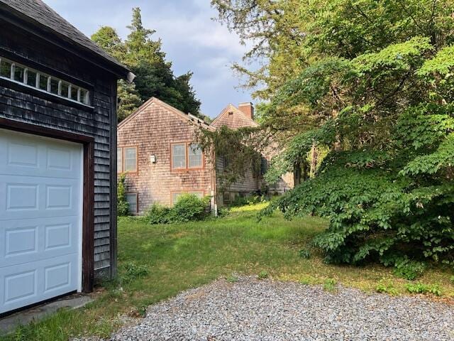 10 Hemenway Ct, Eastham, MA 02642 - view of yard featuring a garage