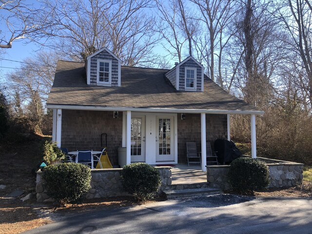 cape cod house with a porch