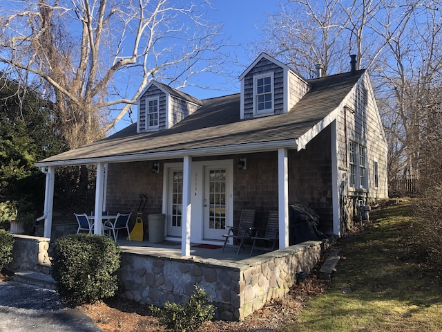 cape cod home with a porch