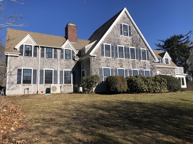 view of front facade featuring ac unit and a front yard