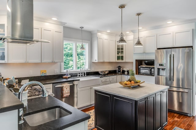 2016 Main St, Chatham, MA 02633 - kitchen featuring appliances with stainless steel finishes, exhaust hood, a sink, dark wood-style flooring, and recessed lighting
